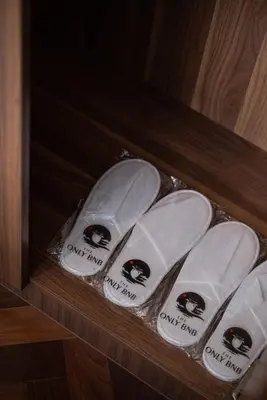 a group of white surfboards in a wooden shelf at Large Family Seaview Suite 3 Rooms by The Only Bnb in Tanjong Tokong