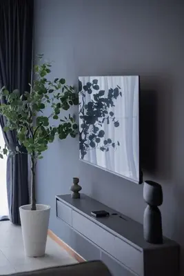 a living room with a plant in a vase on a table at Large Family Seaview Suite 3 Rooms by The Only Bnb in Tanjong Tokong