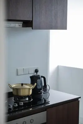 a pot on top of a stove in a kitchen at Large Family Seaview Suite 3 Rooms by The Only Bnb in Tanjong Tokong