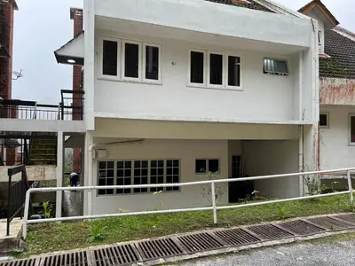 a white house with a fence in front of it at THE MILKY WAY @ PINE RESORT in Bukit Fraser