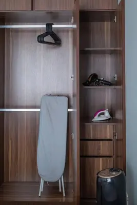 a closet with a white chair in a room at Family Seaview Suite with 3 Rooms by The Only Bnb in Tanjong Tokong