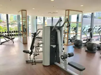 a gym with cardio equipment in a building at Deluxe Seaview Suite Twin Bed by The Only Bnb in Tanjong Tokong