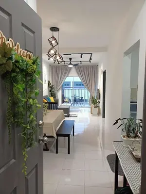 a living room with a couch and a table at Dream 3 @ Emerald avenue in Brinchang