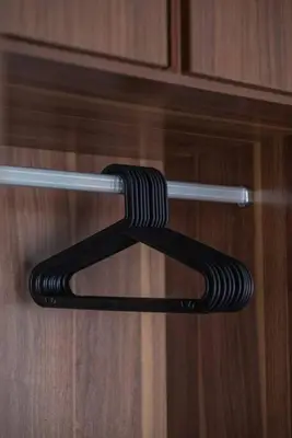 a black object is hanging on a cabinet door at Family Seaview Suite with 3 Rooms by The Only Bnb in Tanjong Tokong