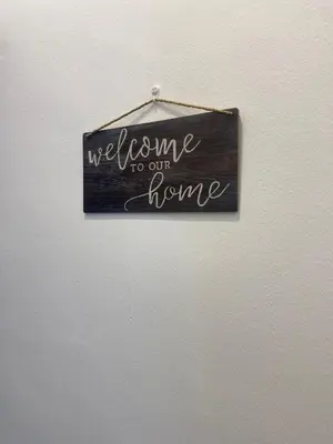 a sign that says welcome to our home on a wall at comfy 3-bedrooms with family karaoke Max-10pax in Ipoh