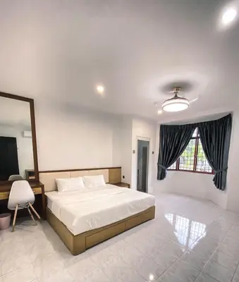 a bedroom with a large bed and a window at Private Bathroom in King Room Bukit Mertajam Alma Impian in Bukit Mertajam