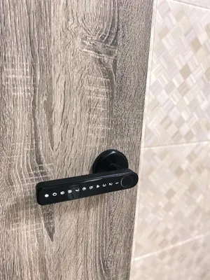 a black door handle on a shower door at Queen Room Bukit Mertajam Alma Impian in Bukit Mertajam