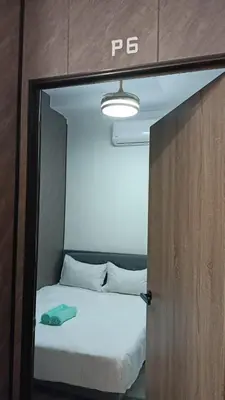 a bed is seen through a door in a room at Queen Room Bukit Mertajam Alma Impian in Bukit Mertajam