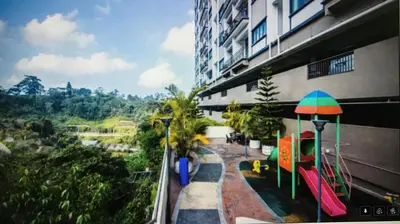 a building with a playground next to a building at Nova Mountain n Sunrise view Hilltop Hotel Apartment in Cameron Highlands in Cameron Highlands