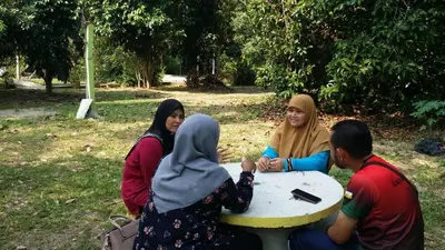 a group of people sitting around a table at Anjung Afilia 1 in Kuala Kangsar