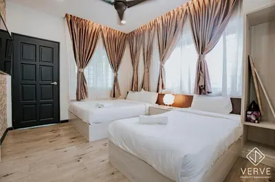 a bedroom with two beds and a window at Ipoh Mansion House 21 by Verve (14pax) EECH74 in Ipoh