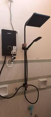 a black stand with a lamp in a room at RUMAH INAP BANDAR PERDANA in Sungai Petani