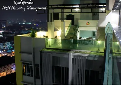 a view of a building with a balcony at night at H2H - Holland Cottage - Majestic Ipoh - 7pax in Ipoh
