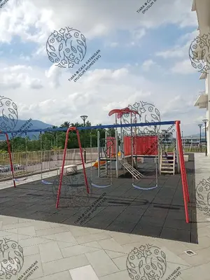 a playground with red and white swings at TIARA @ CASA KAYANGAN (MUSLIM HOMESTAY) in Ipoh