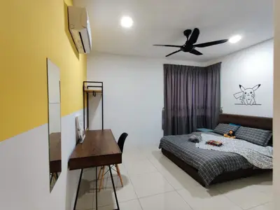 a bedroom with a bed with a ceiling fan and a desk at KT's Homestay- Corner Unit - Manhattan Ipoh Water Park- Station 18 in Ipoh