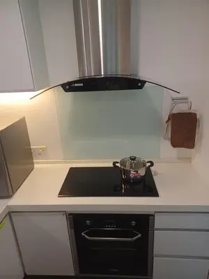a kitchen with a stove with a pot on it at SY Staycation - Apartment in Bayan Lepas