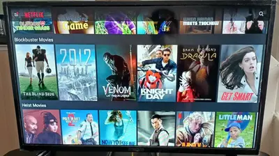 a television screen with many movies on it at SY Staycation - Apartment in Bayan Lepas