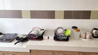 a kitchen counter with three baskets of dishes on it at JackBeansprouts Homestay Botani Ipoh in Ipoh