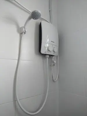 a shower with a shower head in a bathroom at WAFID HOMESTAY SERI ISKANDAR in Seri Iskandar
