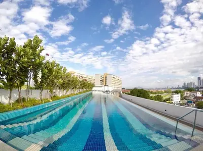 a large swimming pool on the roof of a building at Deluxe Seaview Suite Twin Bed by The Only Bnb in Tanjong Tokong