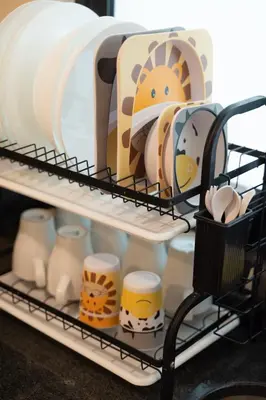 a shelf with cups and toys in a refrigerator at Fantasy Funland Retreat by The Only Bnb in Tanjong Tokong