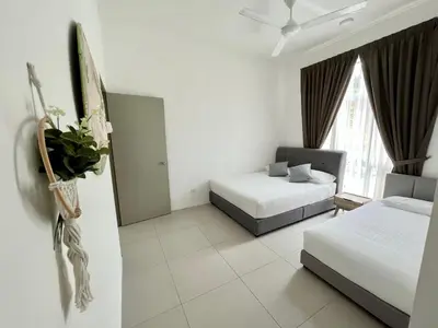 a hotel room with two beds and a window at Aloft Cameron Highland in Brinchang