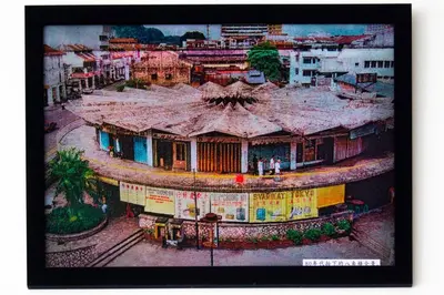 a painting of a building in a city at Octagon Premium Ipoh Town Center 2BR 101 by Grab A Stay in Ipoh