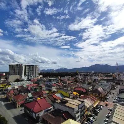 a view of a city with buildings and a cloudy sky at Octagon Premium Ipoh Town Center 2BR 121 by Grab A Stay in Ipoh