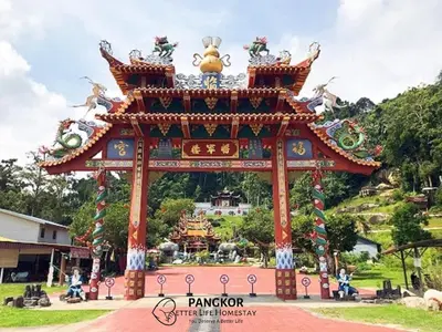 a large gate in a park with a building at Pangkor Better Life Cozy Studio-walking 2min to beach,1-4pax in Pangkor