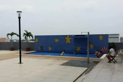 a pool with yellow stars on a blue wall at Pearl Rice Garden \uff08cottage style\uff09\u7c73\u6a02\u574a\u9802\u5c64\u7530\u56ed\u5f0f\u9ad8\u7ea7\u516c\u5bd3 in Sekincan