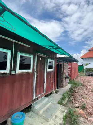 a red train car with a green roof at HOMESTAY Kampong KOTA AUR Resort with swimming pool, Kepala Batas, SEBERANG PERAI, PENANG -MOTAC registered Awarded ASEAN homestay standard Malaysia AWARD 2023-2028 Only 3 minutes from viral KG AGONG in Kepala Batas