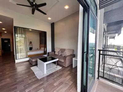 a living room with a couch and a ceiling fan at Hotel Studio Apartment- Fantastic Mountain View (4pax) in Brinchang