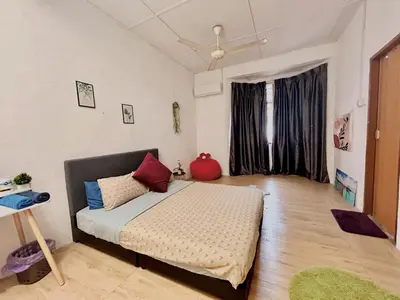 a bedroom with a bed and a large window at Cozy 10 Entire House 4 Bedroom At Alma Bukit Mertajam in Bukit Mertajam