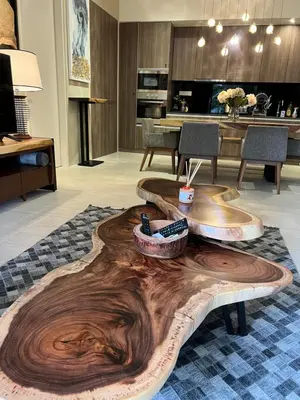 a wooden coffee table in the middle of a living room at By The Sea Beachfront Designer Suites Penang - Managed by Art of Tree in Batu Ferringhi