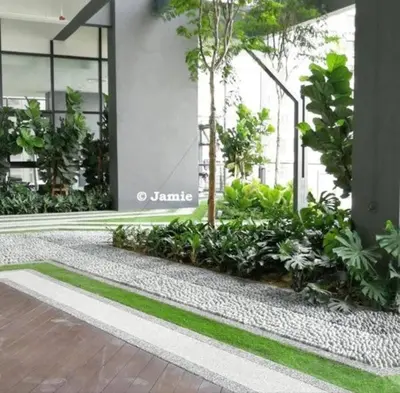 a building with trees and plants in front of it at SOPHIA'S HOME - CITY and HILL VIEW 3BR at 218 Tropicana Macalister with Netflix & TV Box in George Town