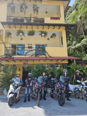 a group of people on motorcycles in front of a building at Highlanders Garden Guesthouse at Arundina Cameron Highlands in Cameron Highlands