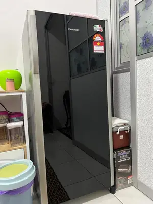 a door that is open in a room at Mieda Rizqi Homestay in Kampong Melayu Changkat Larah