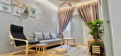 a living room with a couch and two chairs at [Muji-Style Apartment] @ Cameron Jaya (3R2B) 8 pax in Tanah Rata