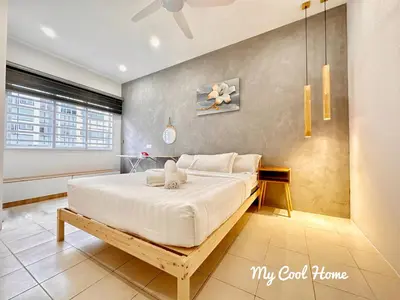 a bedroom with a large white bed in a room at [Muji-Style Apartment] @ Cameron Jaya (3R2B) 8 pax in Tanah Rata