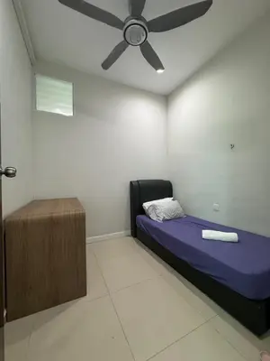 a room with a bed and a ceiling fan at Joyful Guesthouse#IslandHosp in George Town