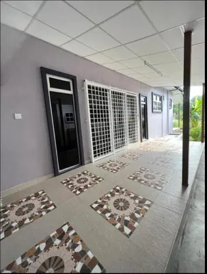 an empty room with tiles on the floor of a building at Homestay Salak 756 at Sungai Siput Kuala Kangsar for Islamic Guest Only in Sungai Siput