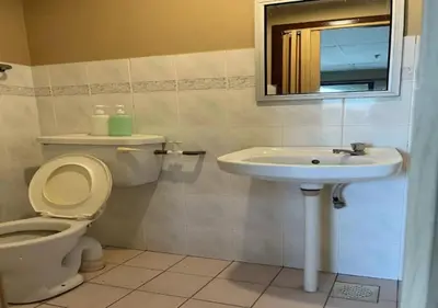 a bathroom with a toilet and a sink at CORAL BAY APARTMENT 3room (Ocean apartment) in Pangkor