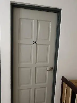 a white door with a black frame in a room at Grey Fantasy Homes#Sunway Water Theme Park in Ipoh