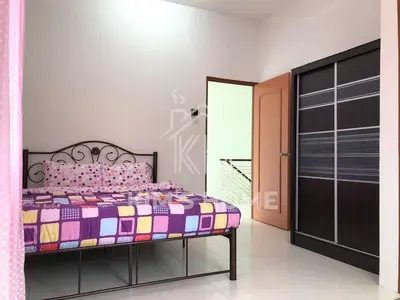 a bedroom with a bed with a colorful bedspread at Kim’s Home - Homey At Your Stay in Nibung Tebal