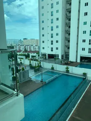 a swimming pool on the roof of a building at Straits Garden Suites by Yen's Sojourn in George Town