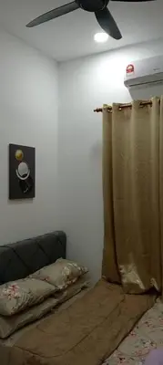 a living room with a ceiling fan and a curtain at D'NAS HOMESTAY - Muslm Only in Sungai Besar