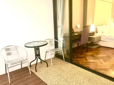 a room with a table and chairs and a bed at Seaview Water Purify Cozy Comfortable for Short & Long Stay in The Landmark by Katana in George Town