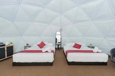 a room with two beds in a tent at Glamz Hills in Cameron Highlands