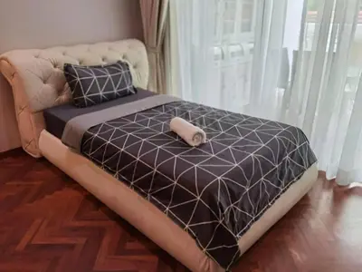 a large bed in a room with a large window at WOW Strait Quay Luxury Suite Room in Tanjong Tokong