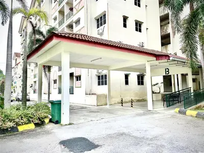 a building with a parking lot in front of it at Zarahome in Tambun